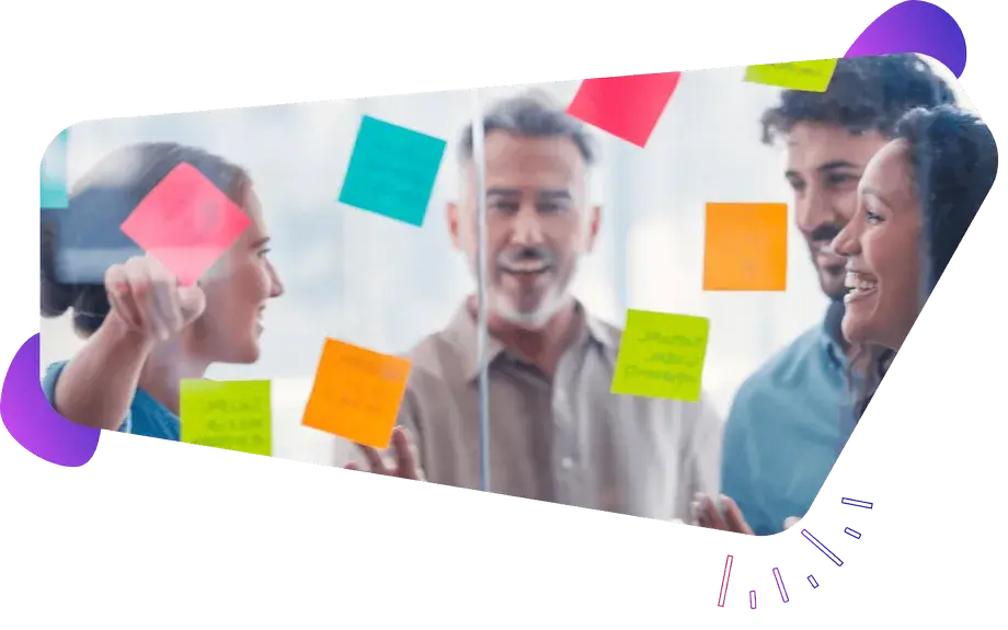 Team engaged in selecting post-it notes, demonstrating collaborative planning and co-decision making in a codesign process.