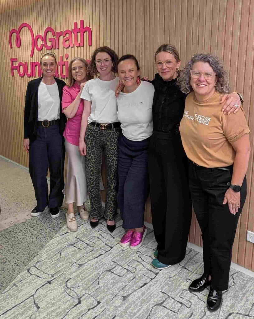 Team McGarth posing together, reflecting unity, collaboration, and community-focused engagement.